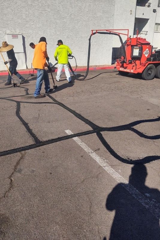 bens asphalt crack sealers and seal coaters working